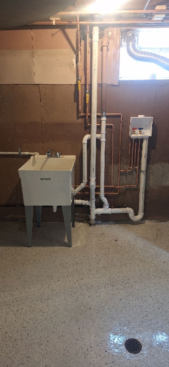 Tankless water heater mounted with organized copper piping