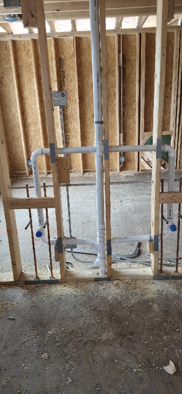 Utility room sink with copper and PVC plumbing connections