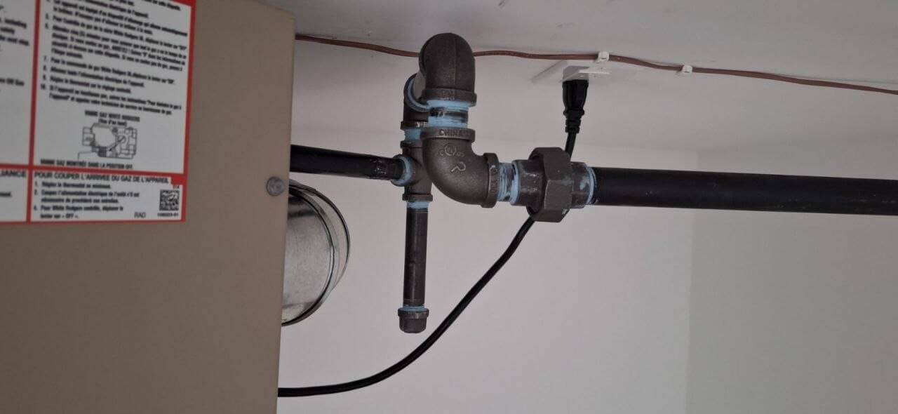 Gas line shut-off and union fitting at appliance connection