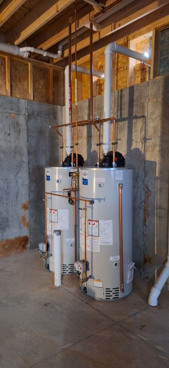 Dual water heater installation with organized copper piping