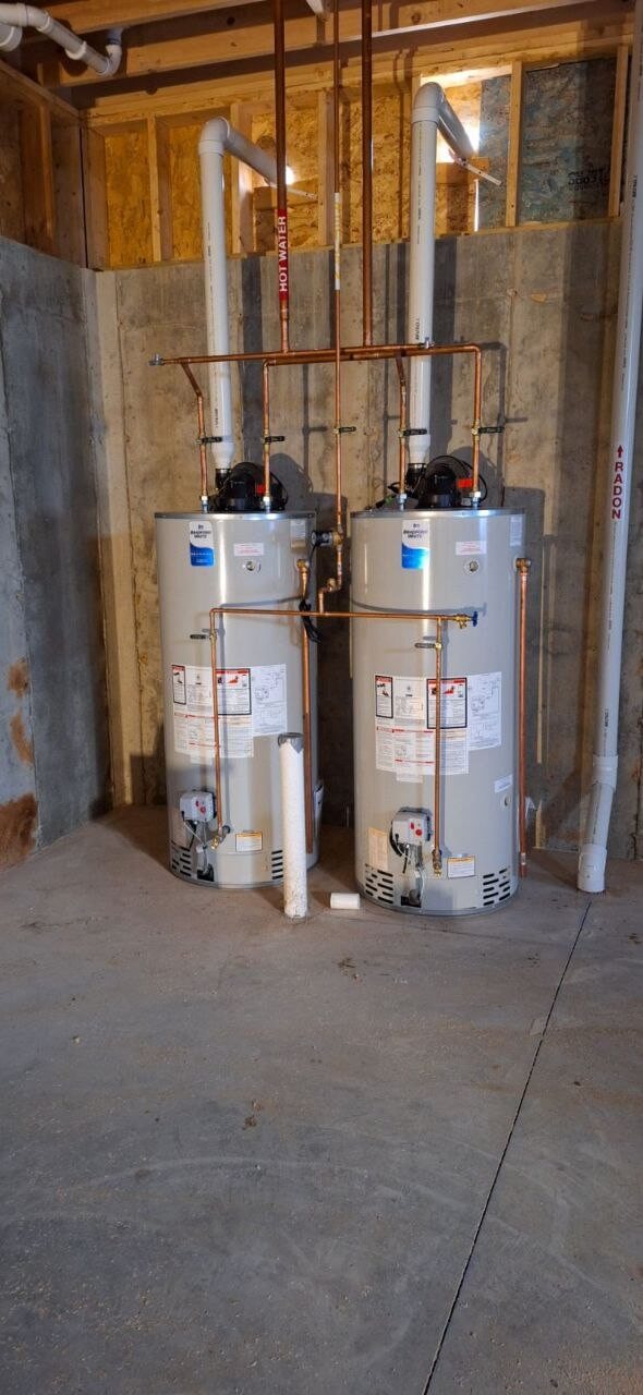 Water heater installation with hot water and radon venting labeled