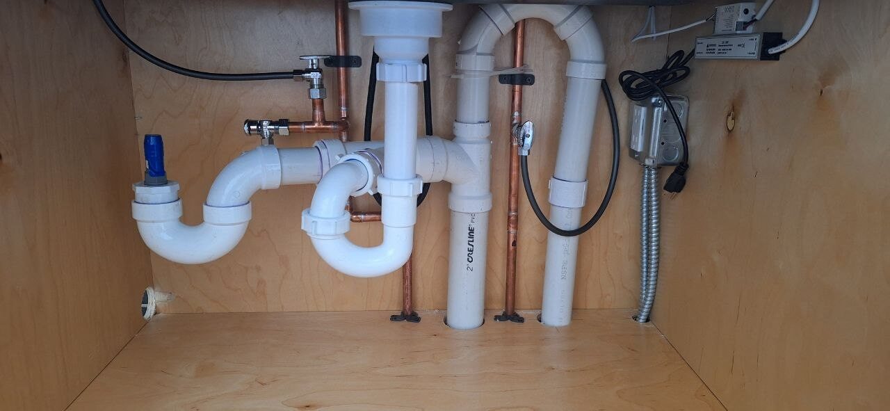 New plumbing rough-in with tankless water heater in new construction